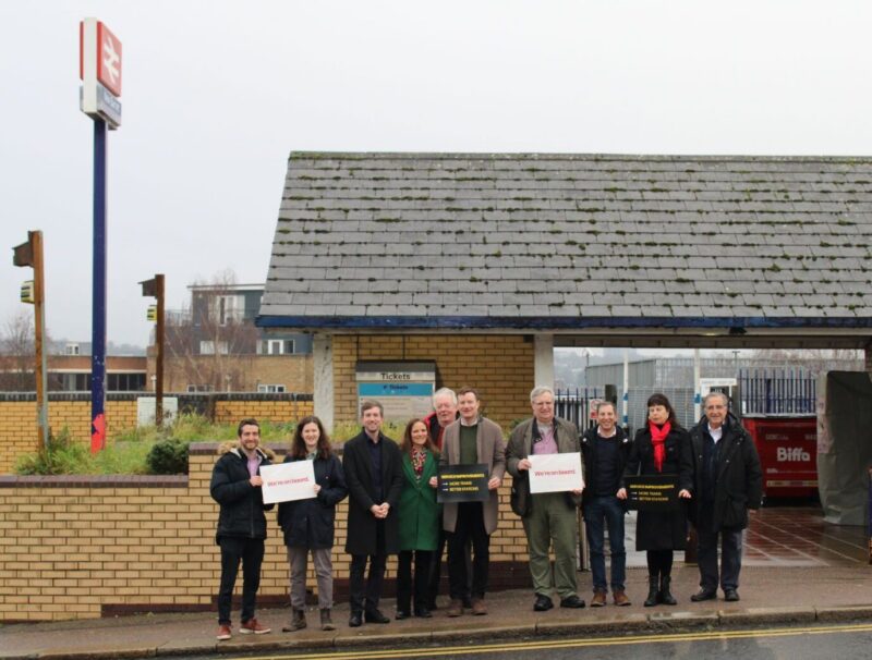Seb Dance, Dan Tomlinson, councillors, and local campaigners, at New Barnet station